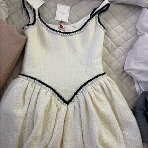 Chic White Mini Dress with Black Trim